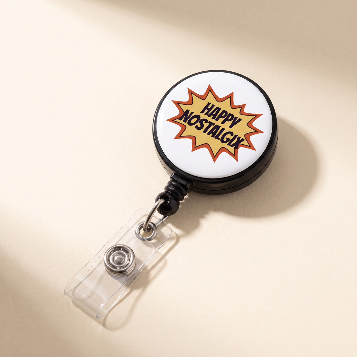 Happy Nostalgix branded badge clip